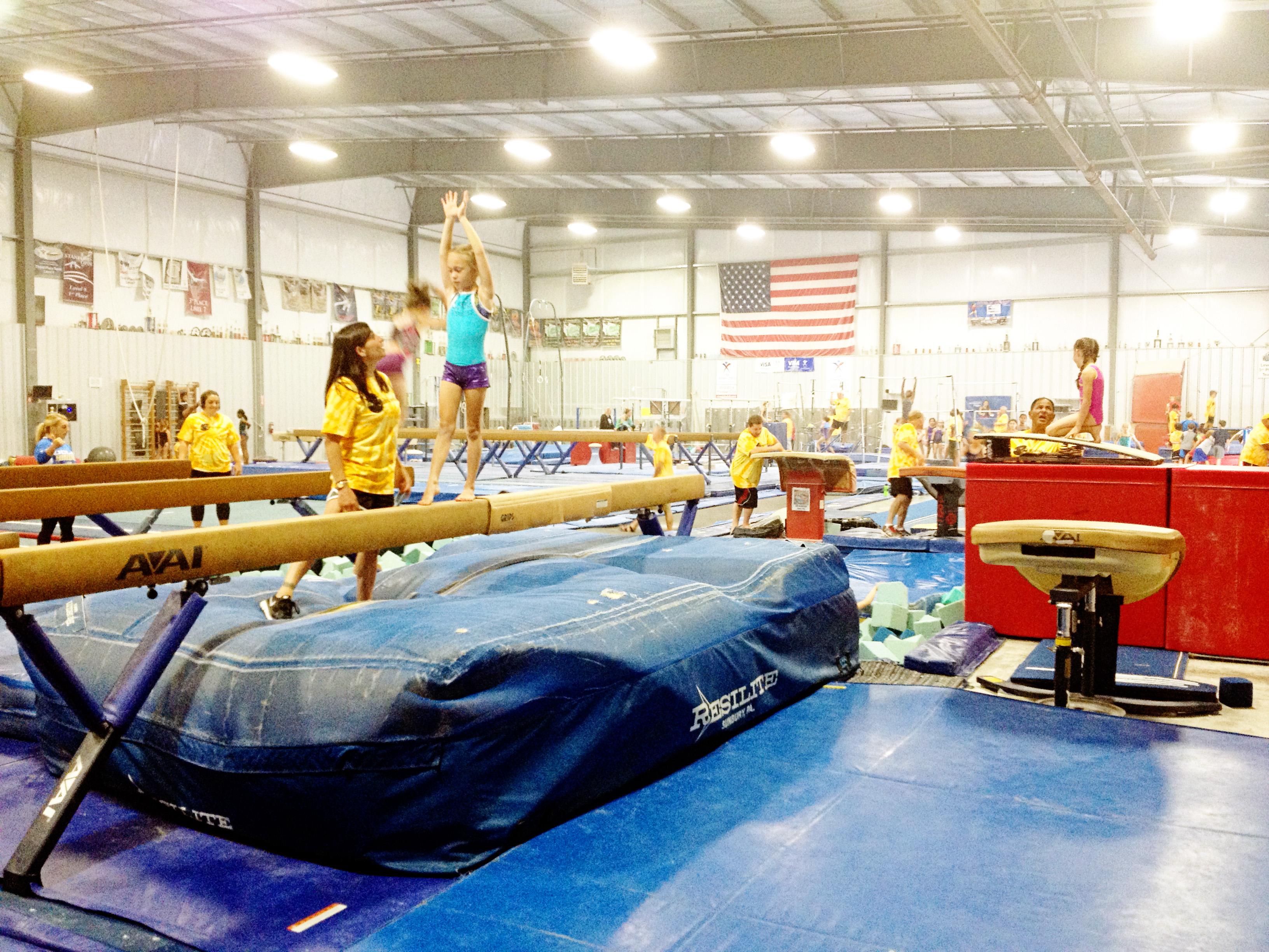 Oregon Olympic Athletics Coach Mohini teaching  beam as a guest coach at Dan Alch's camp of Champions.  